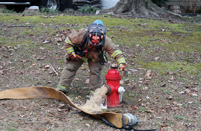 Firefighter with hydrant